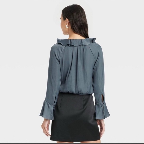 A new day women's flounce long sleeve
V-neck ruffle wrap blouse
Color Teal Blue - Picture 2 of 9